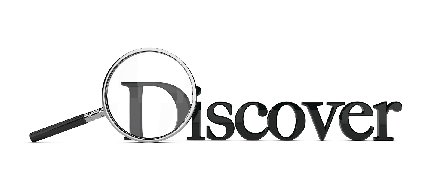 Magnifying glass enlarging the word discover